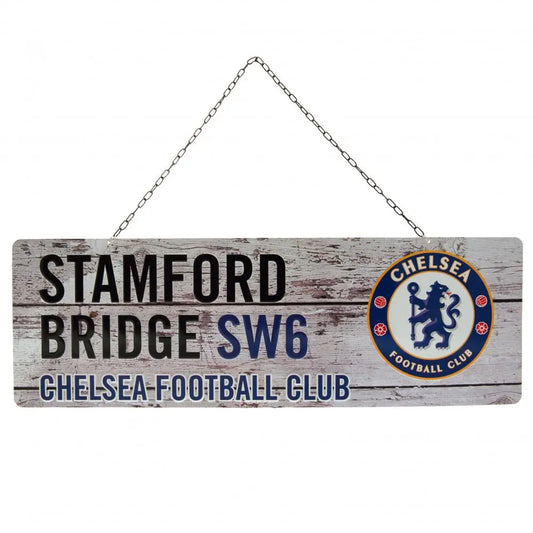 Wooden sign with 'Stamford Bridge SW6 Chelsea Football Club' text and club logo on a white background