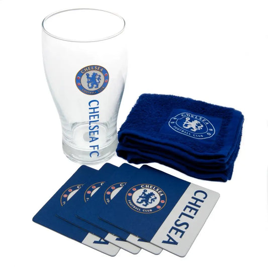 A set of Chelsea FC branded bar accessories including a pint glass, four bar mats, and a bar towel, all laid out on a white background.