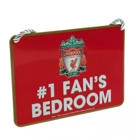 A rectangular red metal sign with the Liverpool FC crest and the text '#1 FAN'S BEDROOM' in white and green.