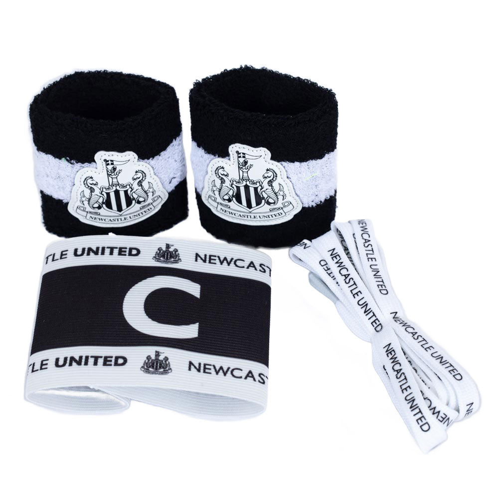 Set of Newcastle United sports accessories including wristbands and headband on a white background
