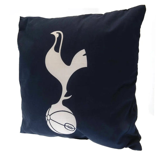 A square navy cushion with the Tottenham Hotspur football club crest printed in white.