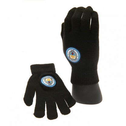 Black Manchester City Kids gloves with a logo on a white background