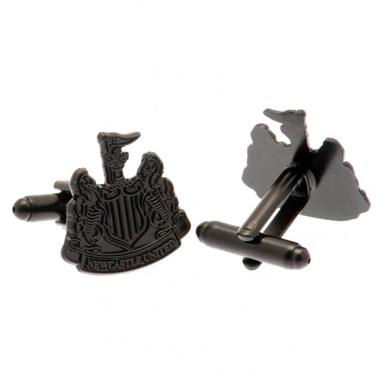 A pair of black cufflinks featuring the Newcastle United football club crest on one side and the club's map outline on the other, shown against a plain white background.