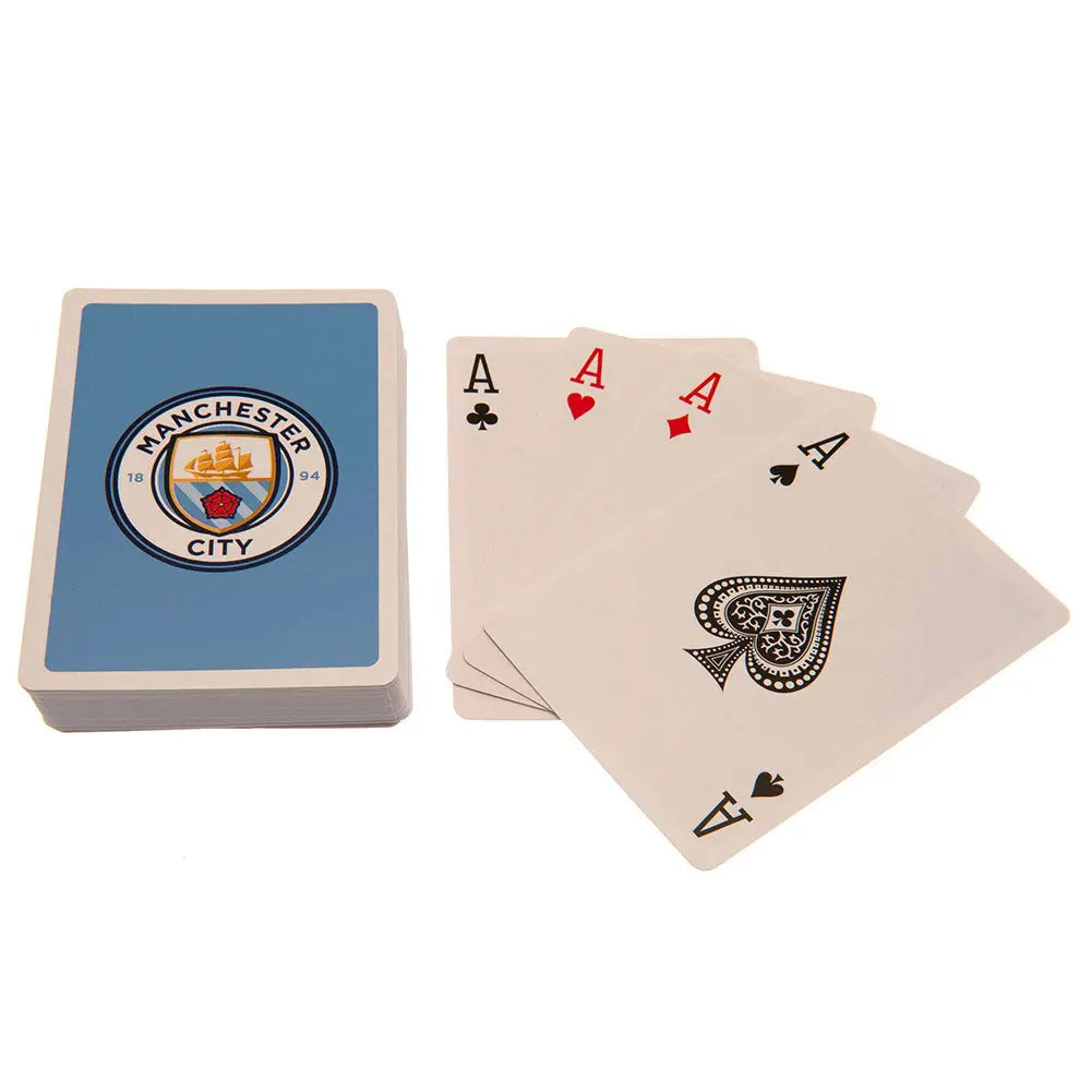 Playing cards with Manchester City logo on a white background