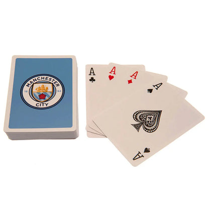 Playing cards with Manchester City logo on a white background