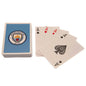 Playing cards with Manchester City logo on a white background