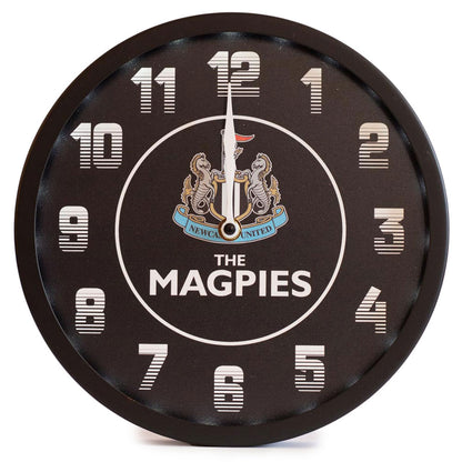 Round wall clock with 'The Magpies' branding on a white background