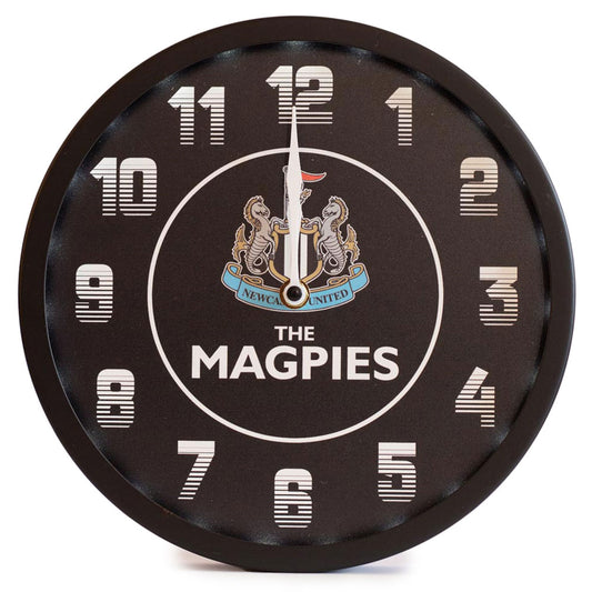 Round wall clock with 'The Magpies' branding on a white background