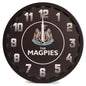Round wall clock with 'The Magpies' branding on a white background
