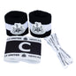 Set of Newcastle United sports accessories including wristbands and headband on a white background
