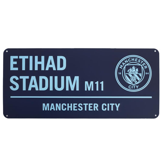 Manchester City Etihad Stadium sign with club logo on a white background
