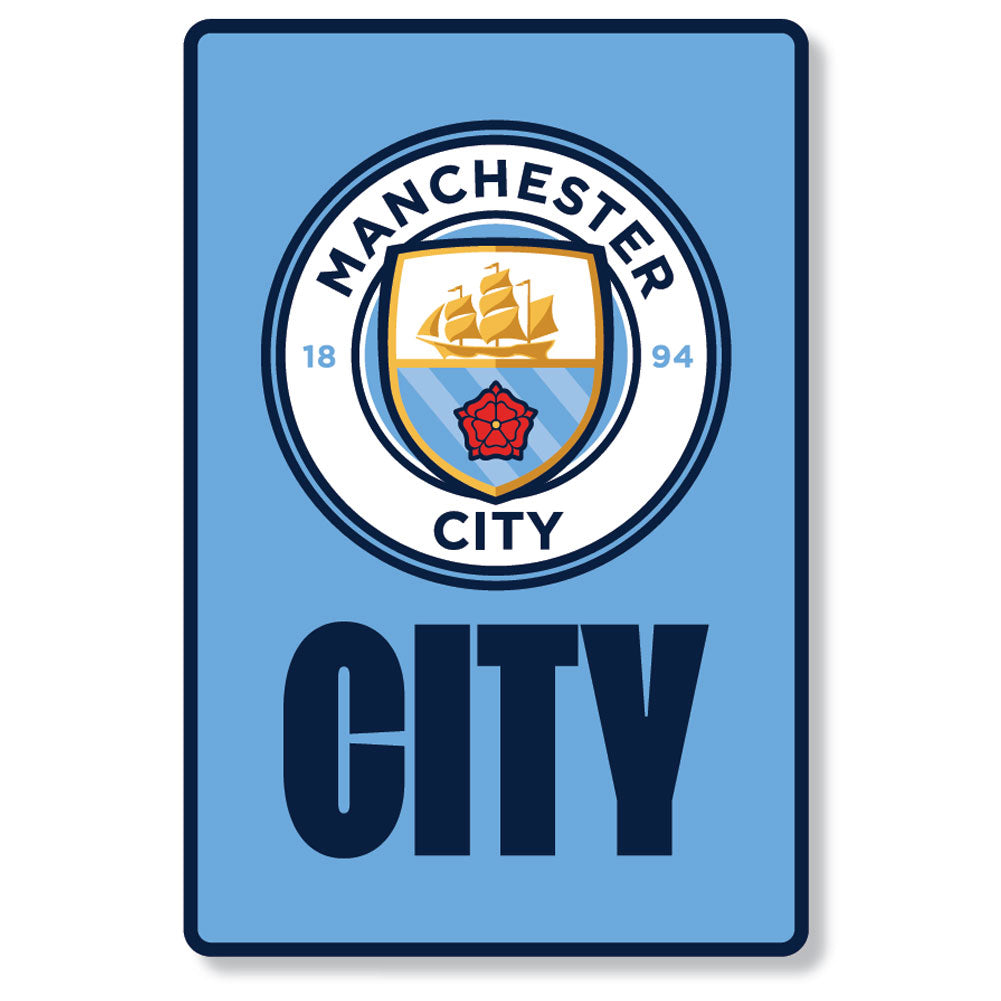 A Manchester City themed rectangular sign or poster with a light blue background, featuring the club crest at the top and the word 'CITY' in large dark blue letters at the bottom.