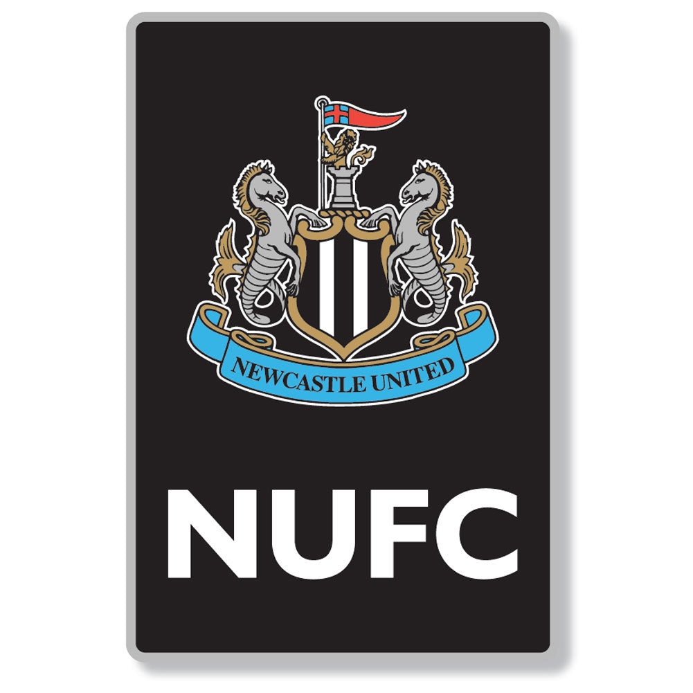 A rectangular black sign or sticker featuring the Newcastle United crest at the top and the large white letters 'NUFC' below, shown on a light gray background.