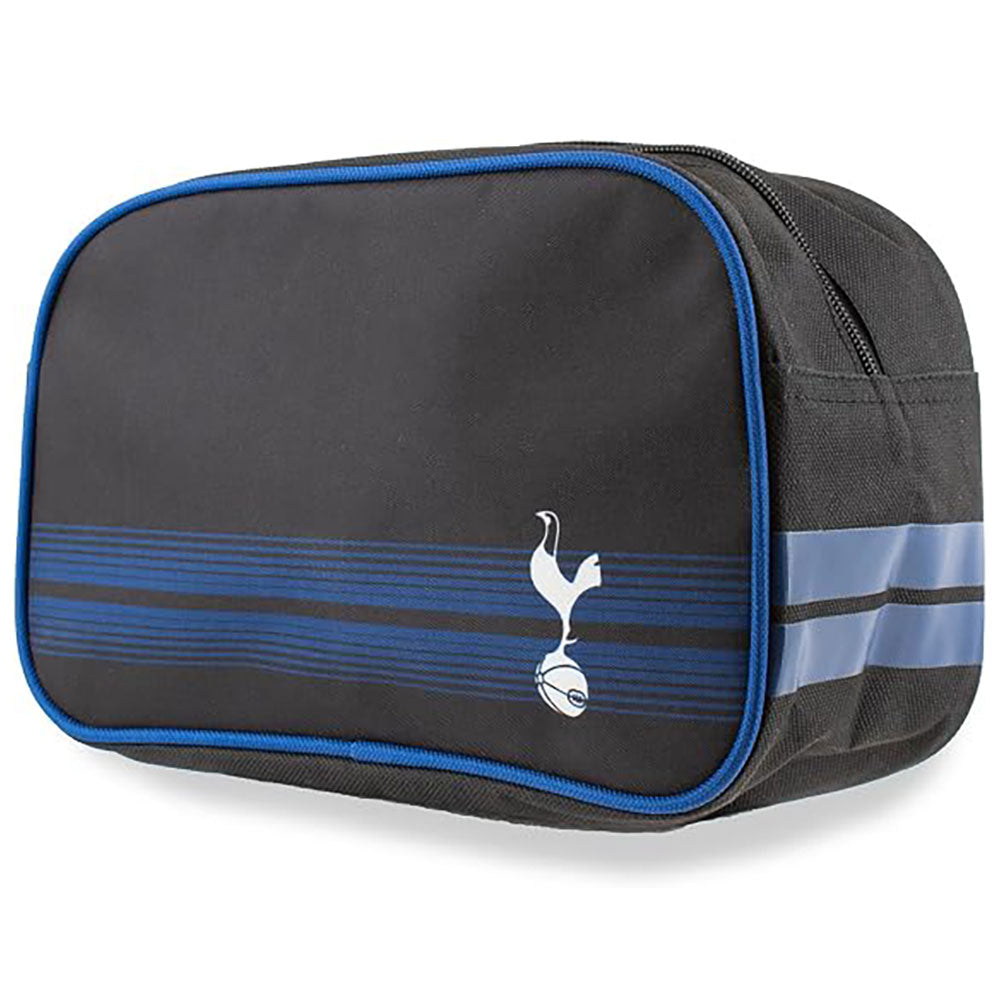A blue toiletry bag with blue piping, featuring the Tottenham Hotspur logo and blue horizontal stripes on the front, set against a plain white background.