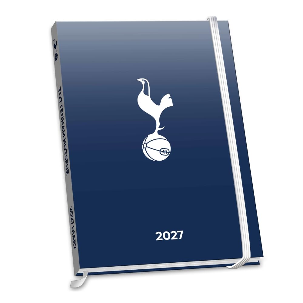 A 2027 Tottenham Hotspur football calendar notebook with a navy blue gradient cover, featuring the white club crest and '2027' printed on the front, complete with a white elastic closure band.
