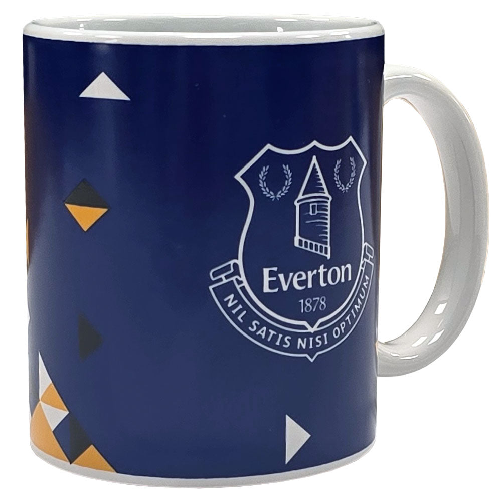A navy blue ceramic mug with the Everton FC crest printed in white on the front, decorated with small geometric triangle patterns in white, yellow, and black. The mug has a white handle and interior, shown against a plain white background.